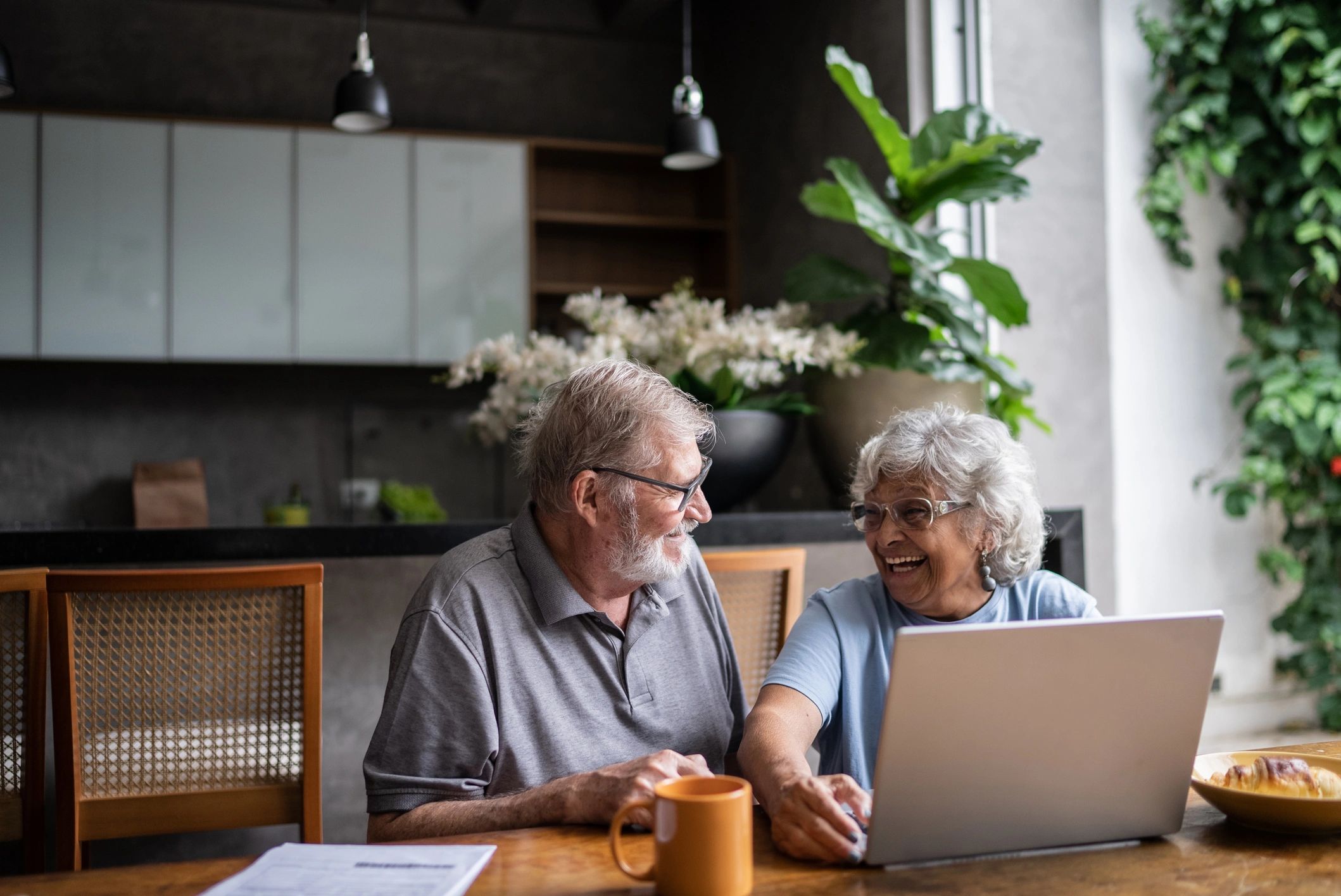 Senior couple reviewing finances as they plan for retirement
