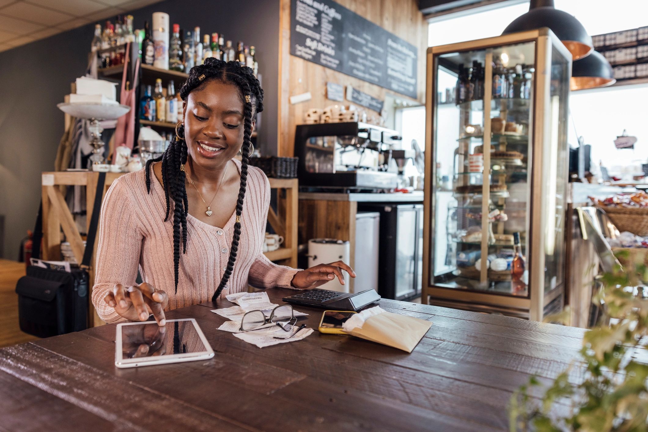 Business owner reviewing financial documents and planning decisions
